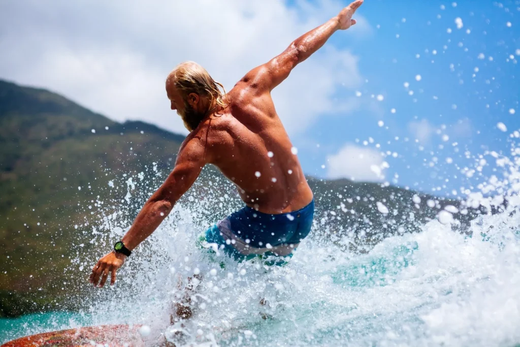 man surfing actively